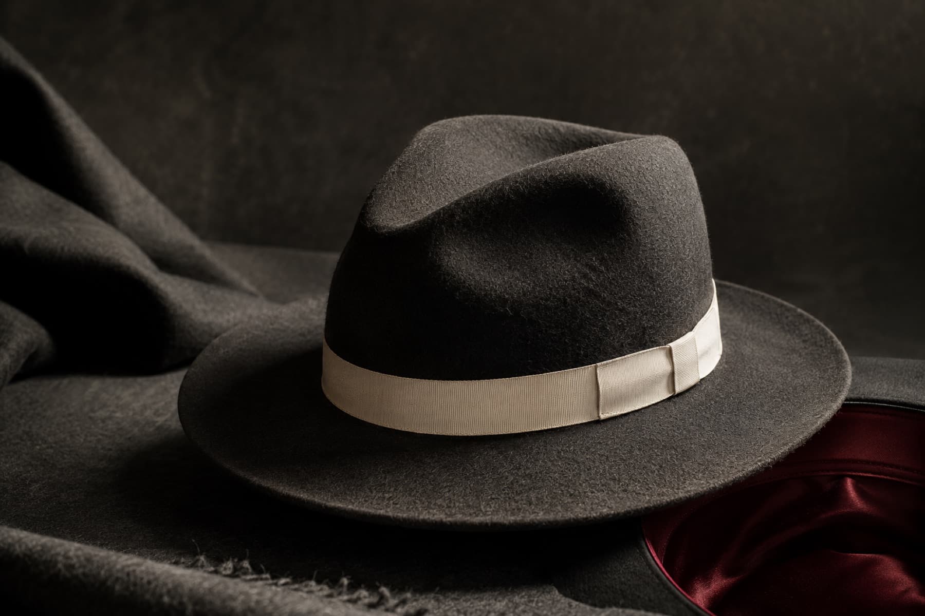 Fedora Wool 7cm: charcoal felt hat photographed whole under a single hard side light