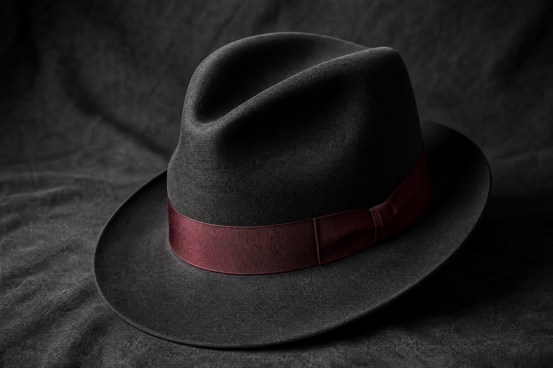Fedora Fine Rabbit: charcoal felt hat photographed whole under a single hard side light