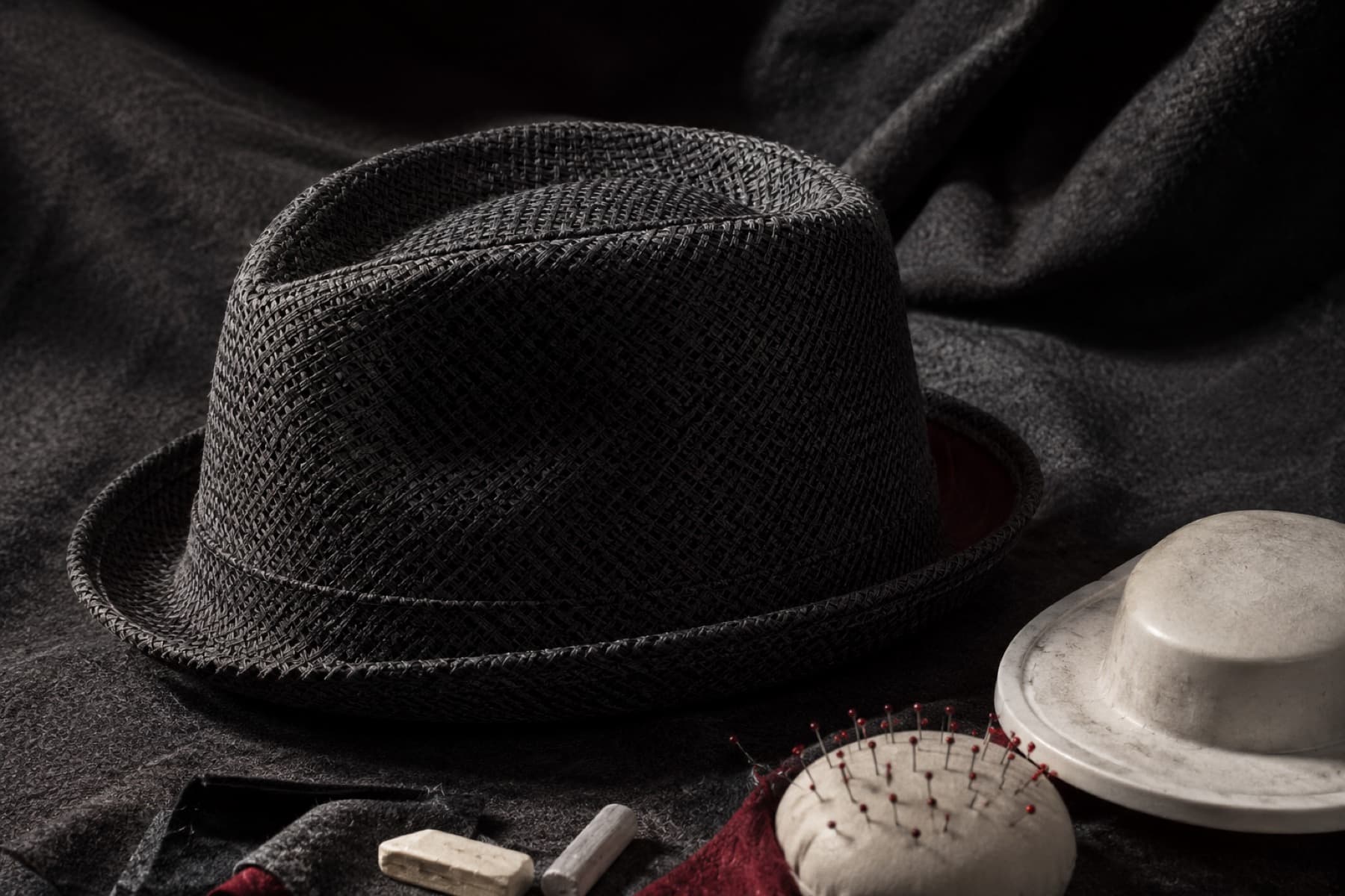 Trilby Textured: charcoal felt hat photographed whole under a single hard side light