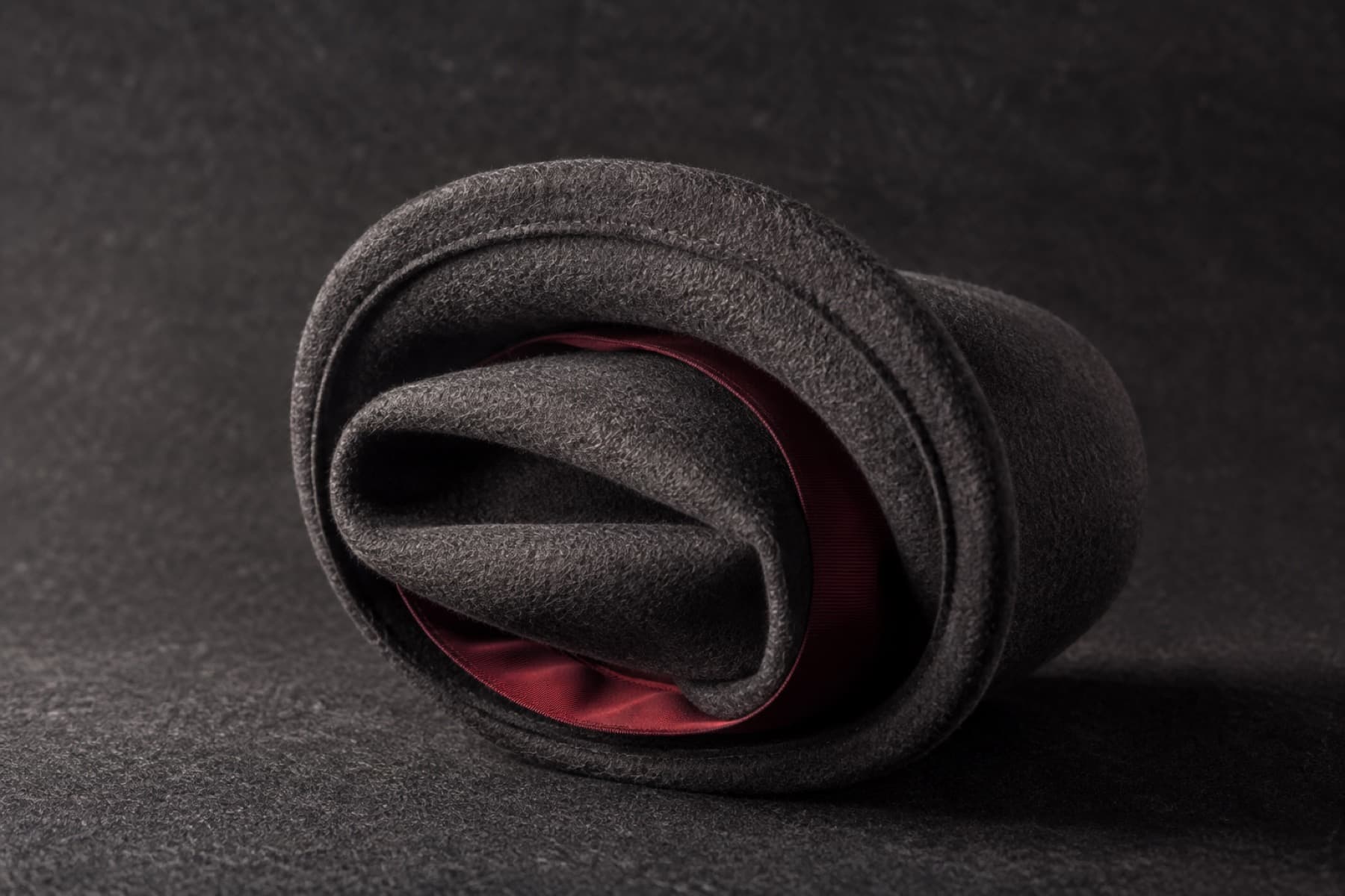 Packable Wool 6cm: charcoal felt hat photographed whole under a single hard side light